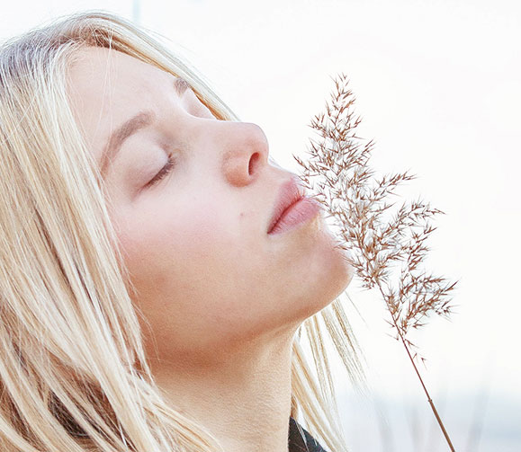 blonde women closes eyes and relaxes